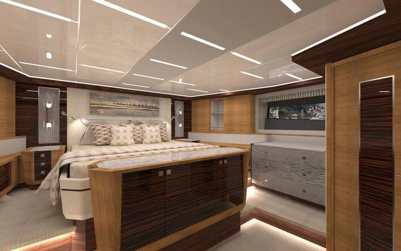 a room with a bed and a desk aboard VOYAGER Yacht for Sale