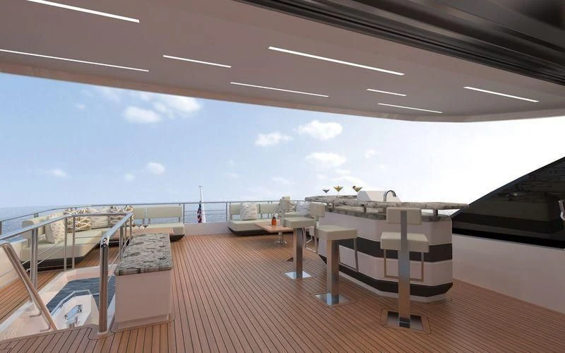 a deck with a view of the ocean and a deck aboard VOYAGER Yacht for Sale