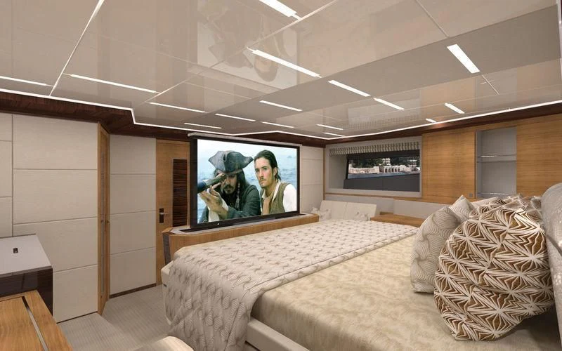 a room with a bed and a television aboard VOYAGER Yacht for Sale