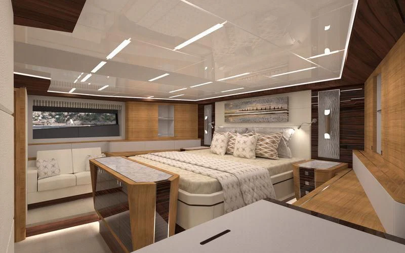 a room with a bed and a table aboard VOYAGER Yacht for Sale