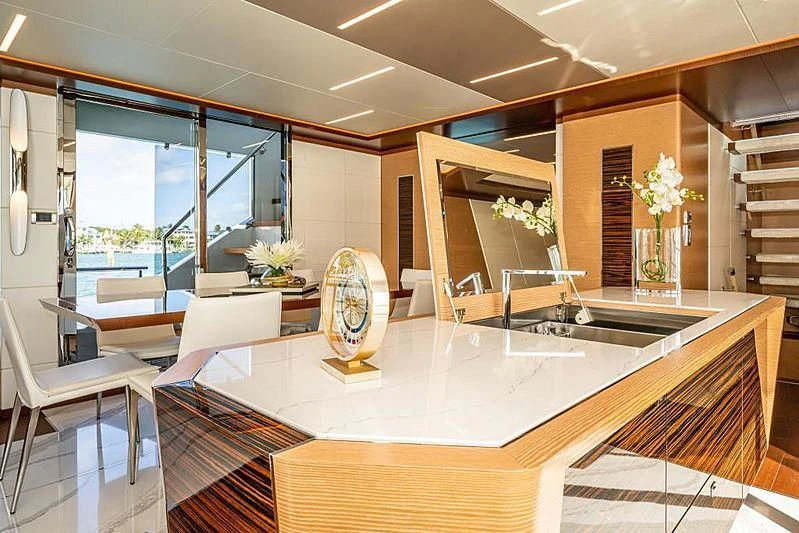 a large kitchen with a large island aboard VOYAGER Yacht for Sale