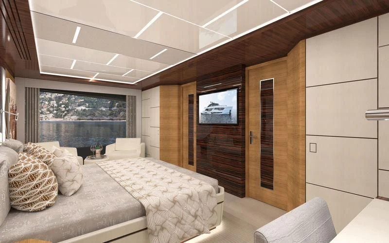 a room with a bed and a tv aboard VOYAGER Yacht for Sale
