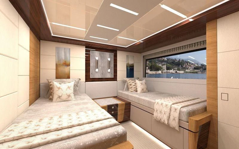 a room with a bed and a window aboard VOYAGER Yacht for Sale