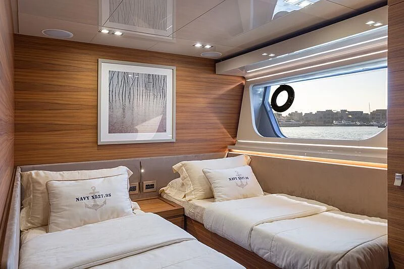 a room with two beds aboard MIRA 1 Yacht for Sale