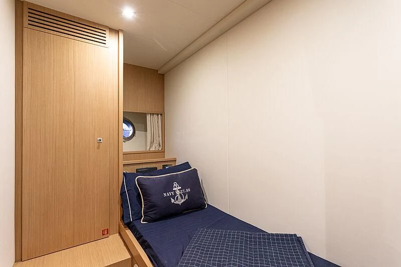 a bedroom with a bed and a closet aboard MIRA 1 Yacht for Sale