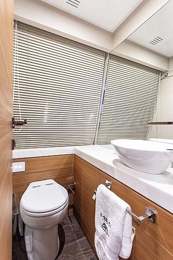 a bathroom with a toilet and sink aboard MIRA 1 Yacht for Sale