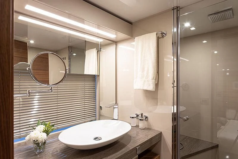 a bathroom with a large mirror aboard MIRA 1 Yacht for Sale