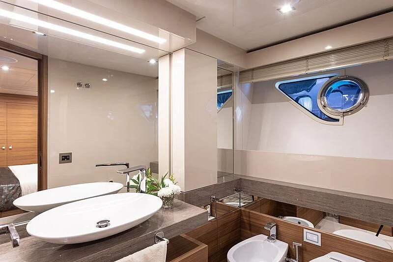 a bathroom with sinks and mirrors aboard MIRA 1 Yacht for Sale