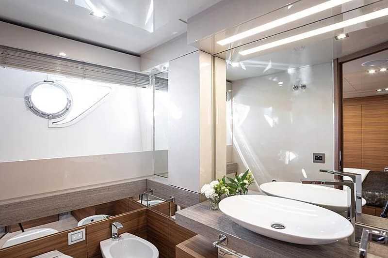 a bathroom with a large mirror aboard MIRA 1 Yacht for Sale