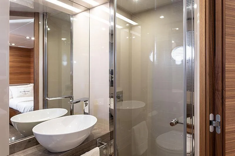 a bathroom with a glass shower aboard MIRA 1 Yacht for Sale