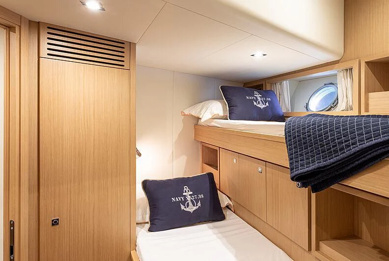 a room with a bed and a desk aboard MIRA 1 Yacht for Sale