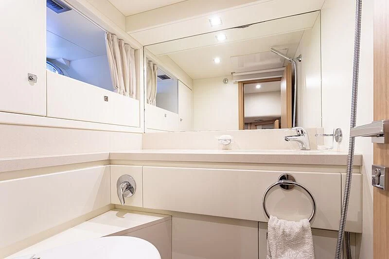 a bathroom with a large mirror aboard MIRA 1 Yacht for Sale