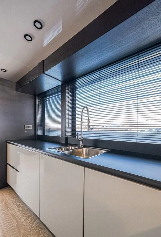 a kitchen with a sink and a window aboard ONYX 87/01 Yacht for Sale