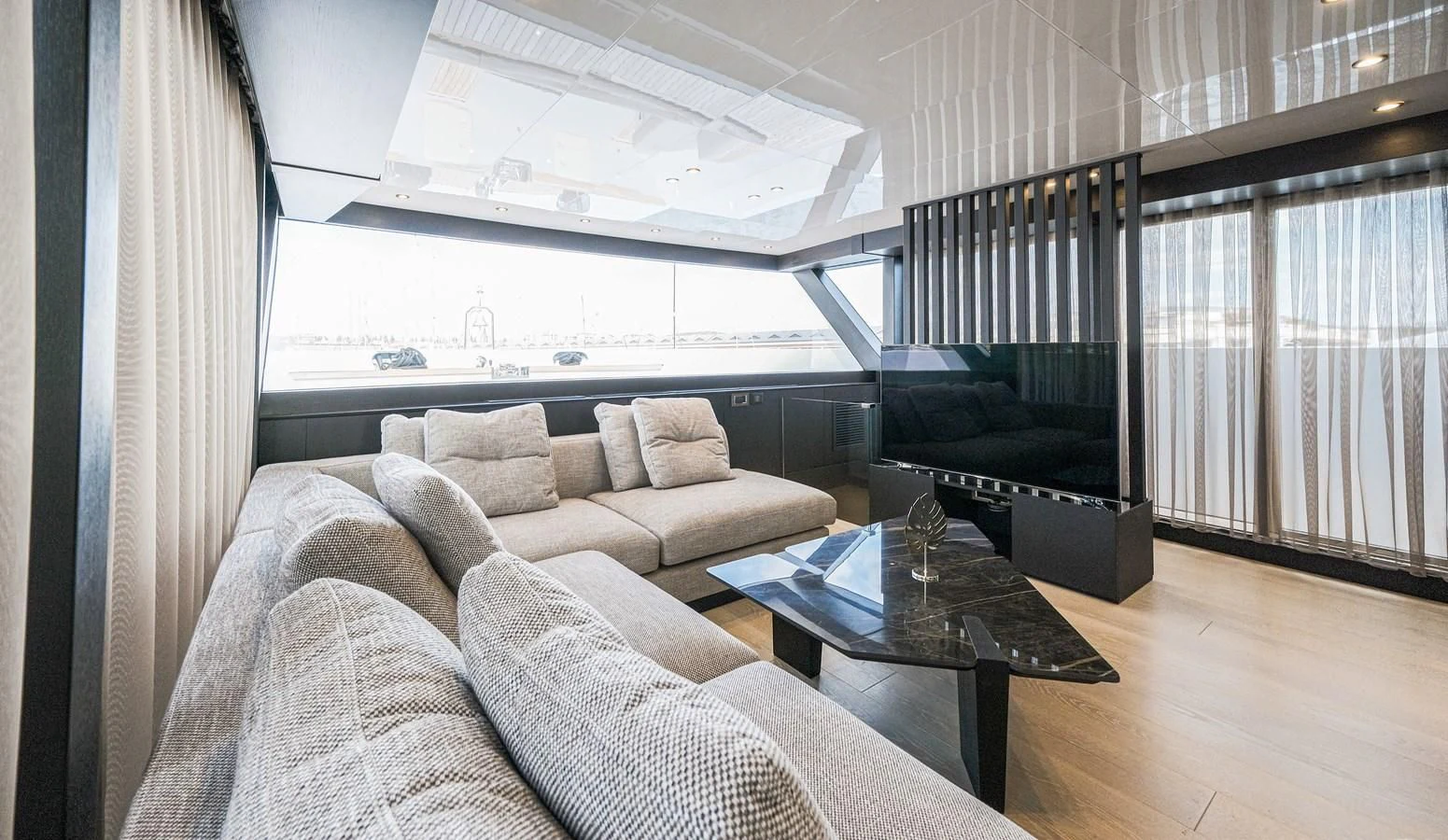 a living room with a couch and a coffee table aboard ONYX 87/01 Yacht for Sale