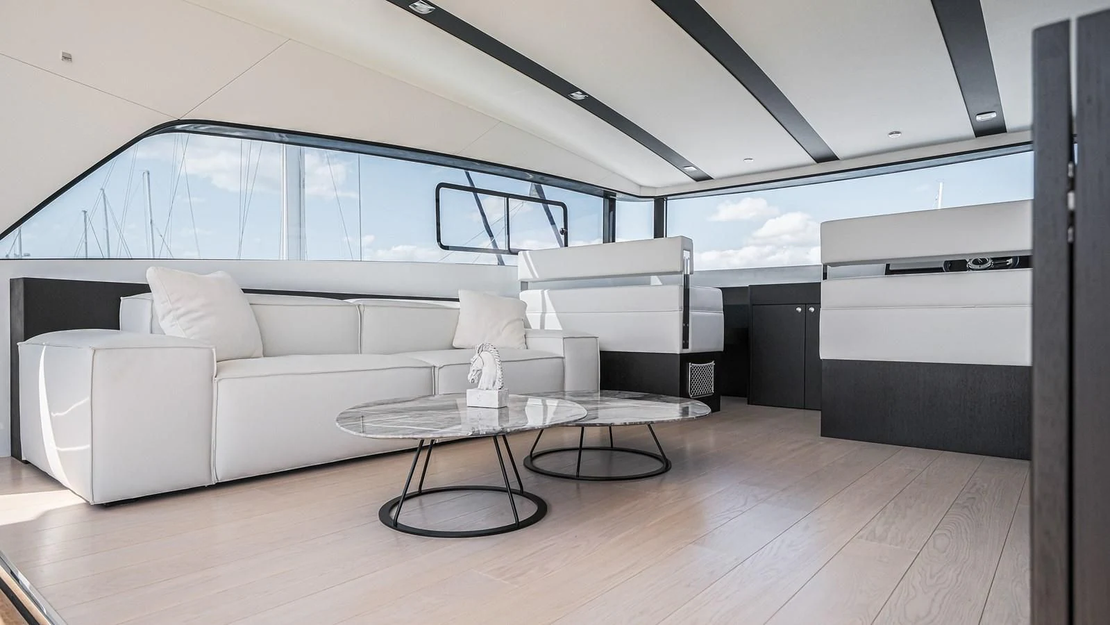 a room with a couch and a table aboard ONYX 87/01 Yacht for Sale