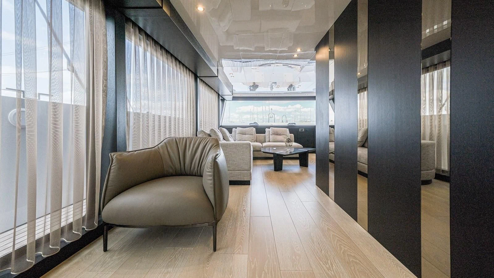 a room with a couch and a table aboard ONYX 87/01 Yacht for Sale