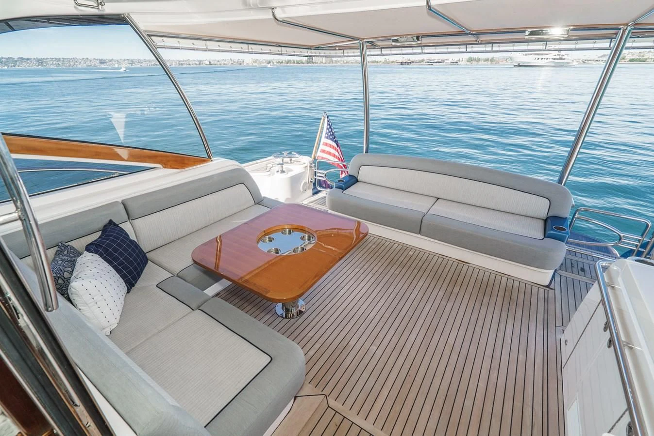 a boat with a flag on the deck aboard VALENCIA Yacht for Sale
