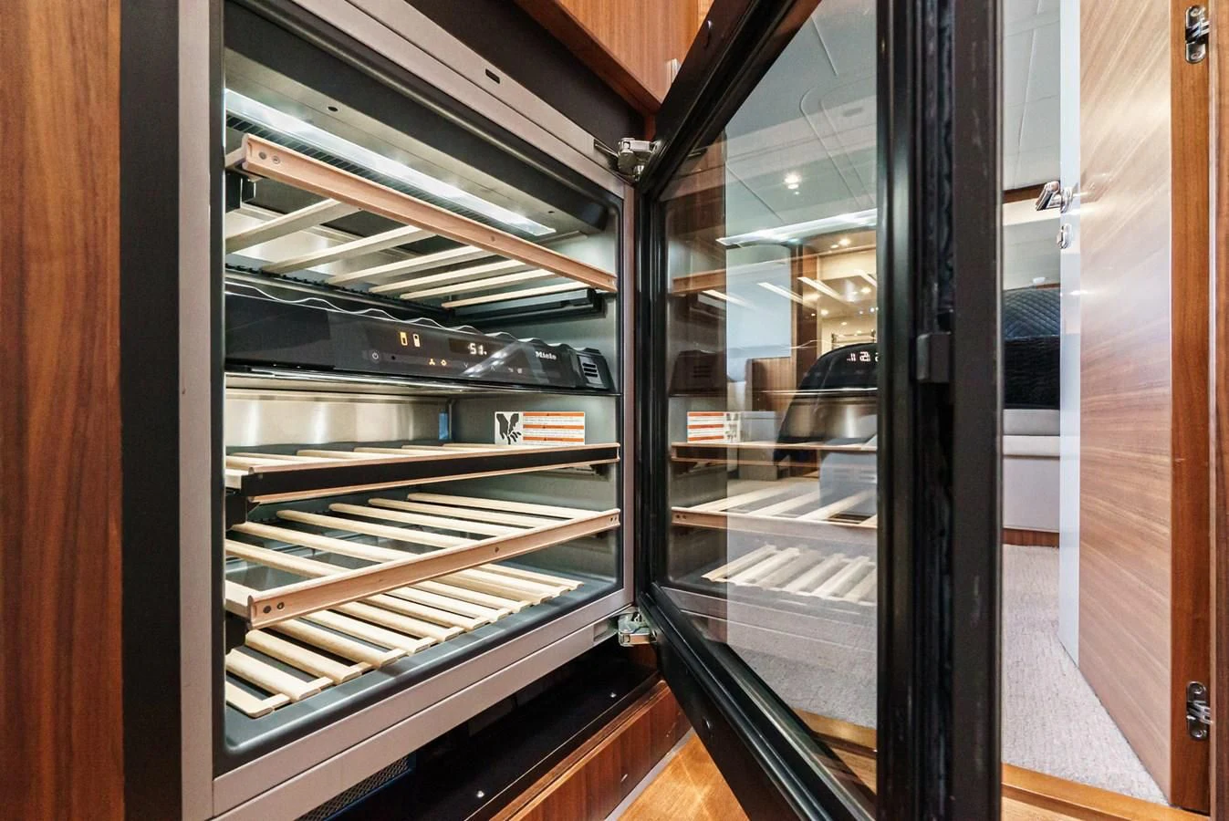 a glass case with a door open aboard VALENCIA Yacht for Sale