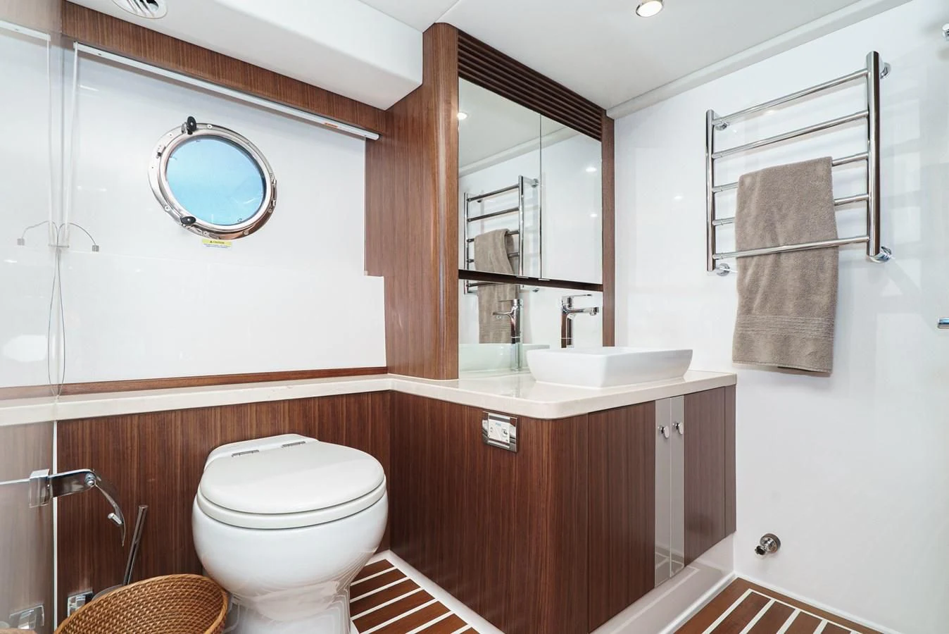 a bathroom with a toilet and a sink aboard VALENCIA Yacht for Sale