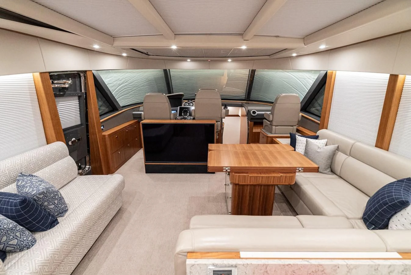 a living room with a couch and a table aboard VALENCIA Yacht for Sale
