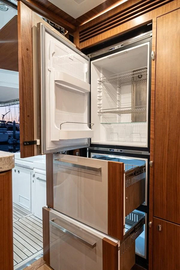 a kitchen with a refrigerator aboard VALENCIA Yacht for Sale
