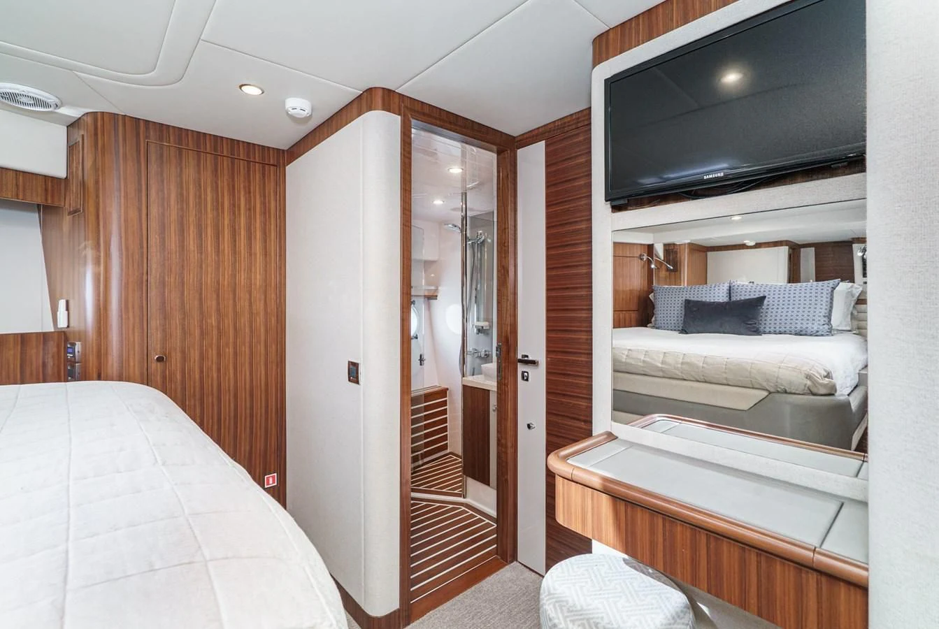a room with a bed and a television aboard VALENCIA Yacht for Sale