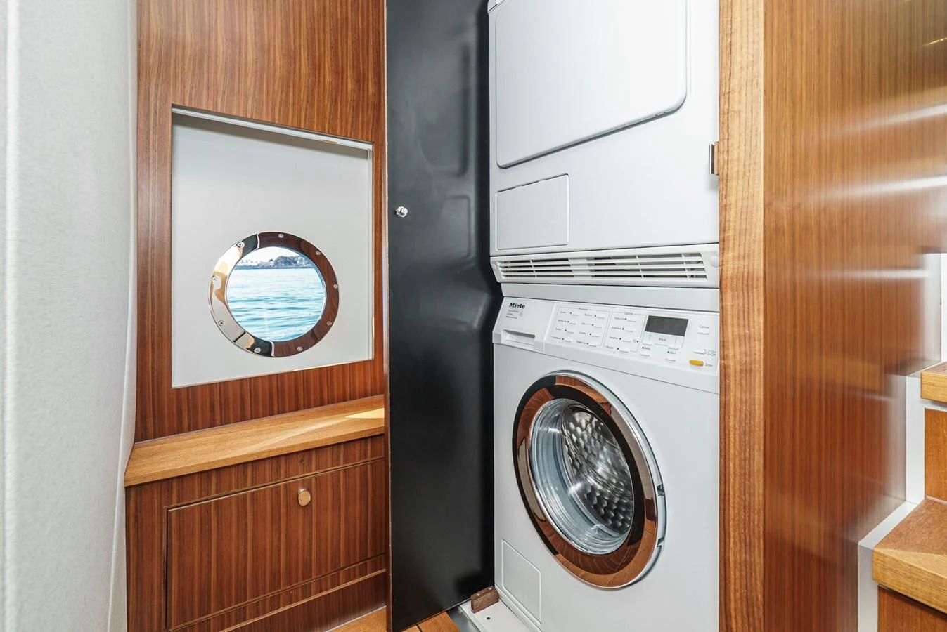 a washer and dryer in a closet aboard VALENCIA Yacht for Sale
