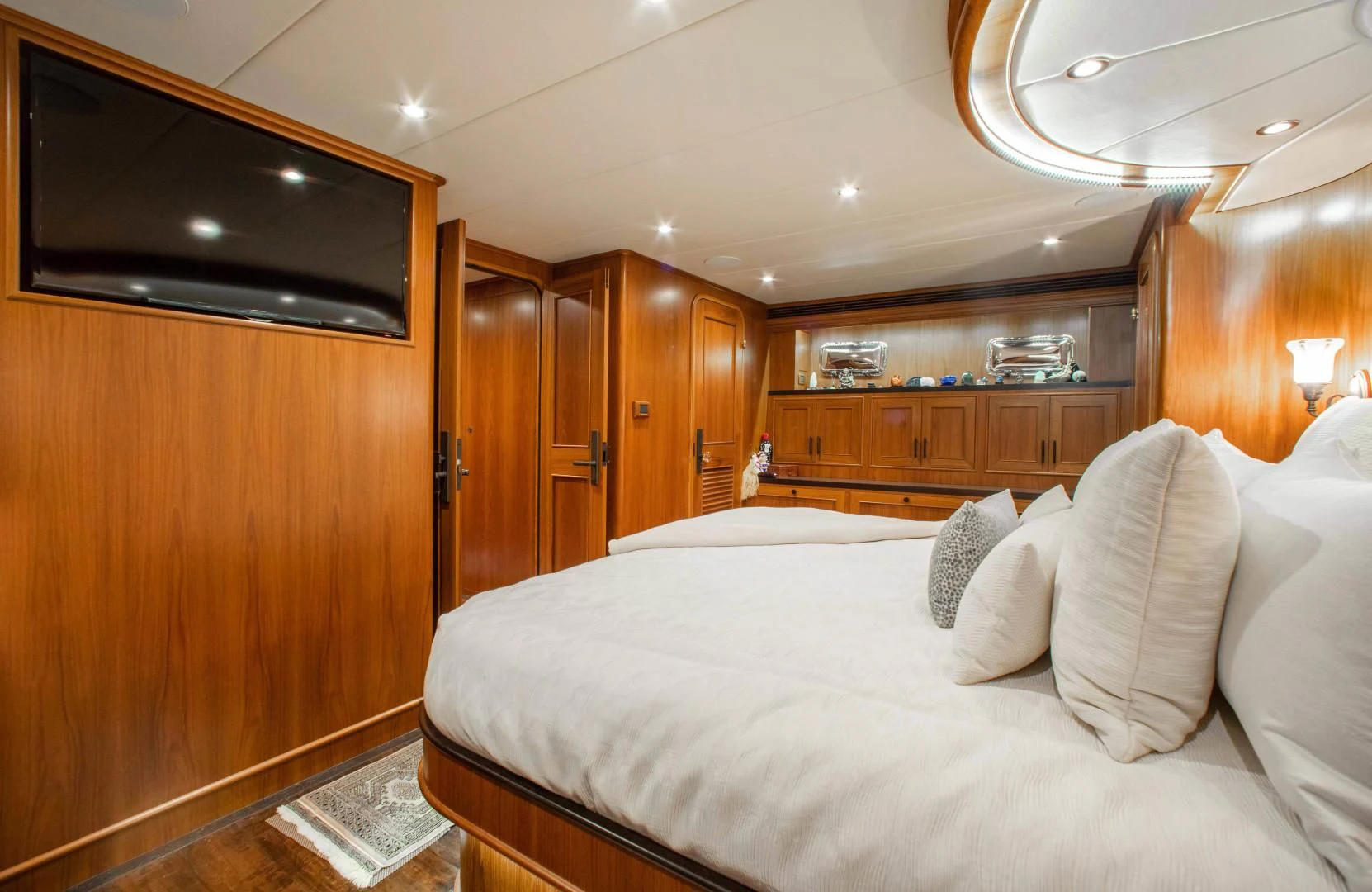 a bedroom with a bed and a television aboard ON LIBERTY Yacht for Sale