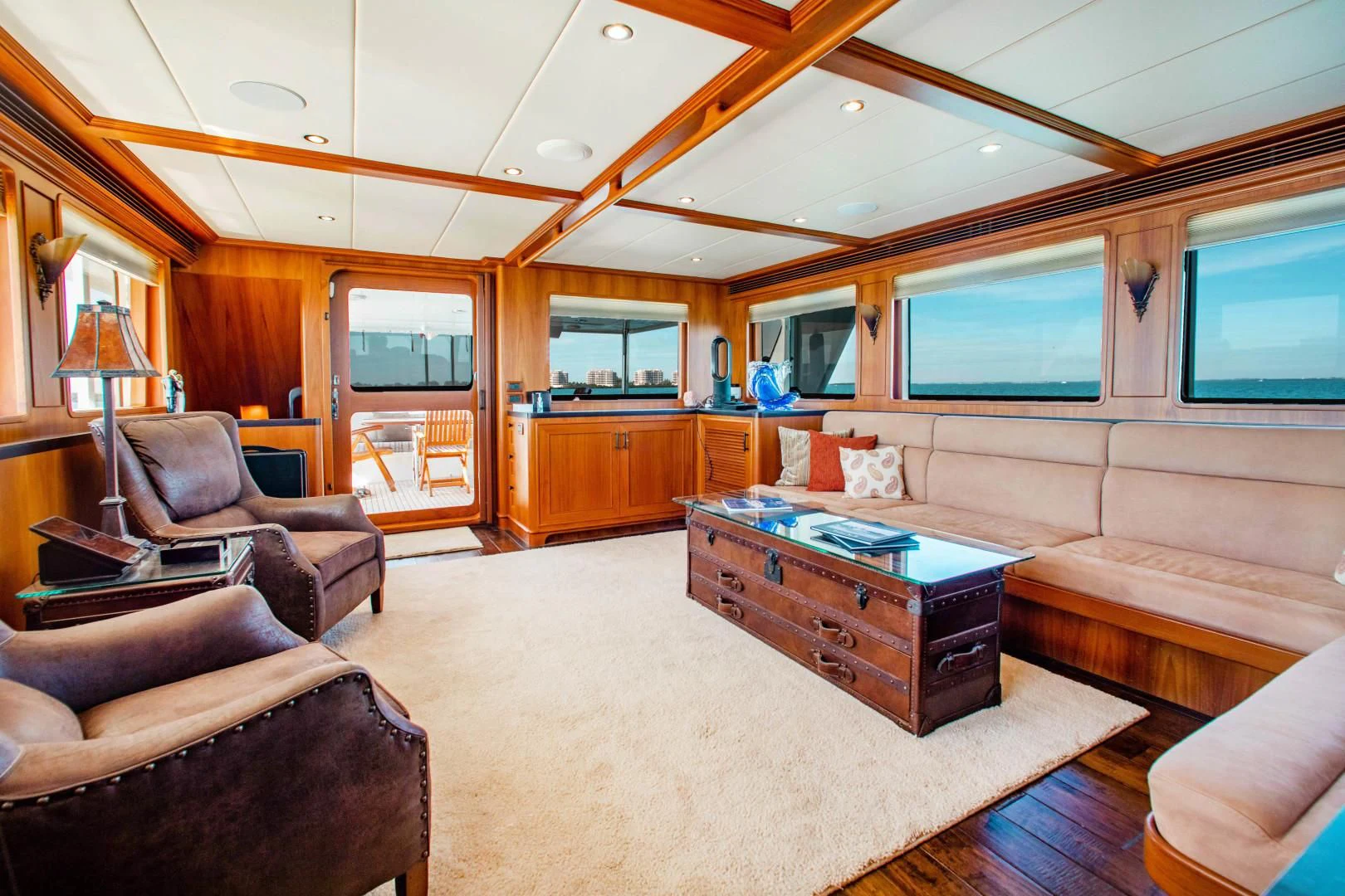 a living room with a wood floor aboard ON LIBERTY Yacht for Sale