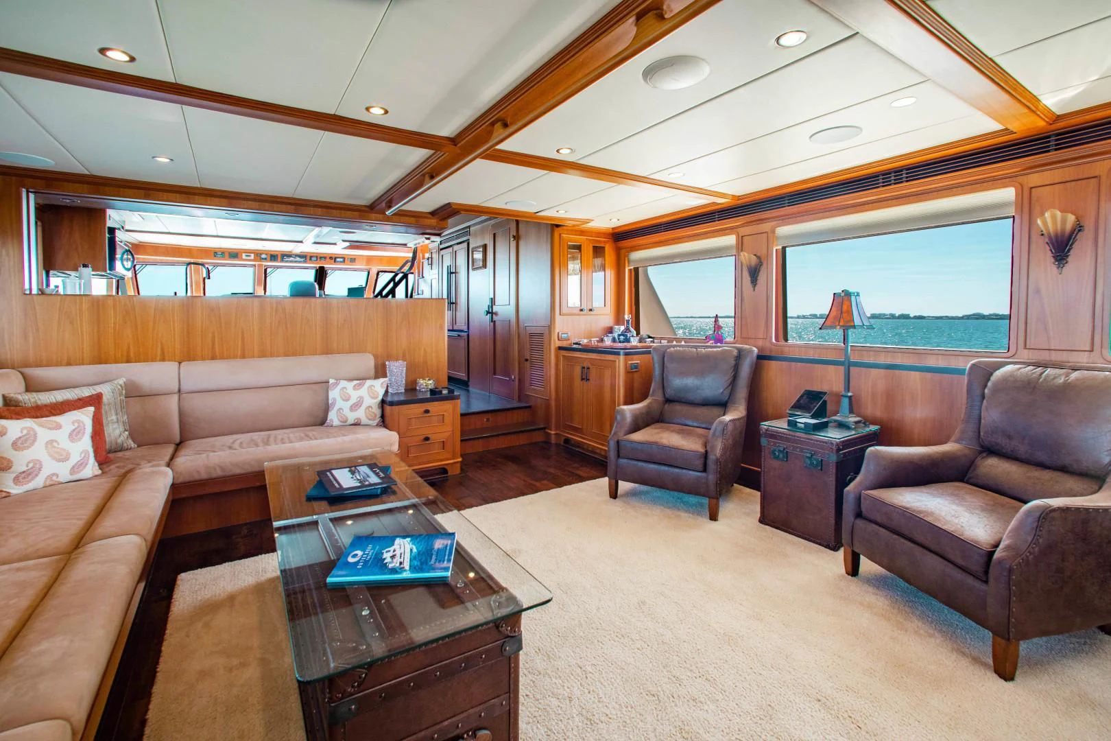 a living room with a couch and a coffee table aboard ON LIBERTY Yacht for Sale