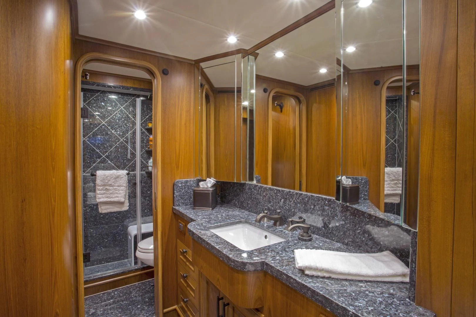 a bathroom with a large mirror aboard ON LIBERTY Yacht for Sale