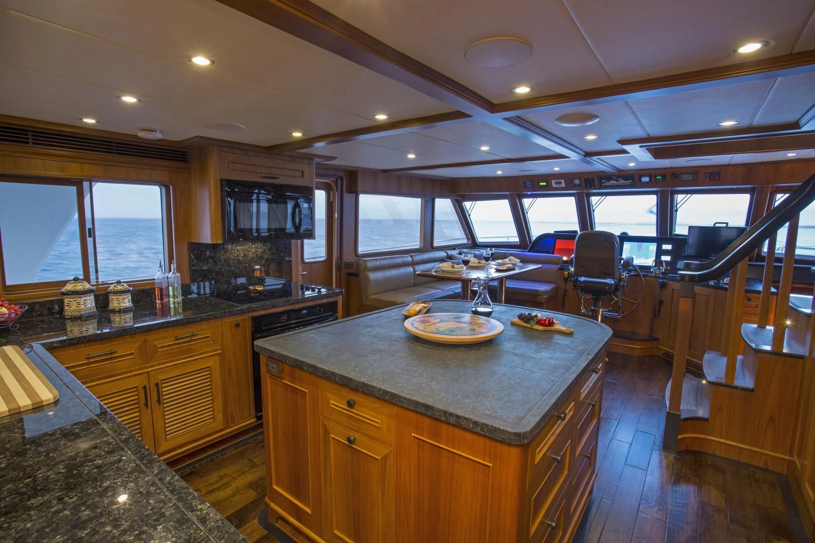 a kitchen with a large island aboard ON LIBERTY Yacht for Sale