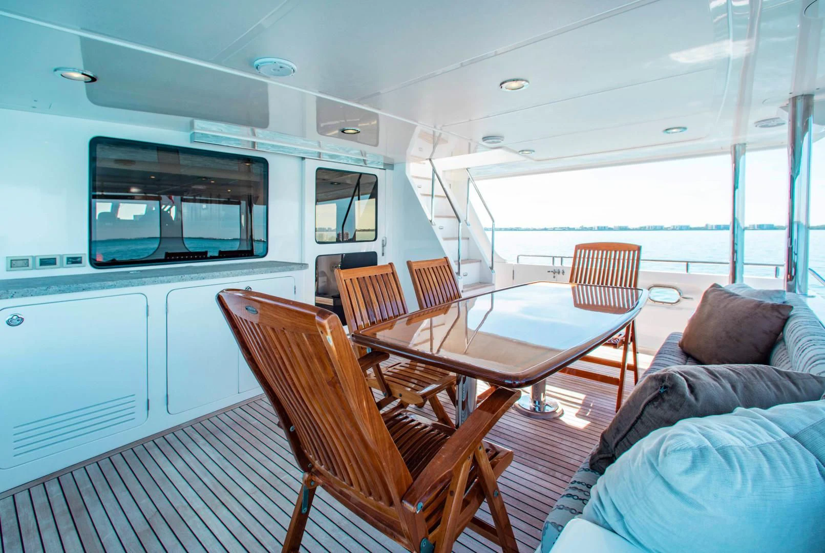 a boat with a table and chairs aboard ON LIBERTY Yacht for Sale