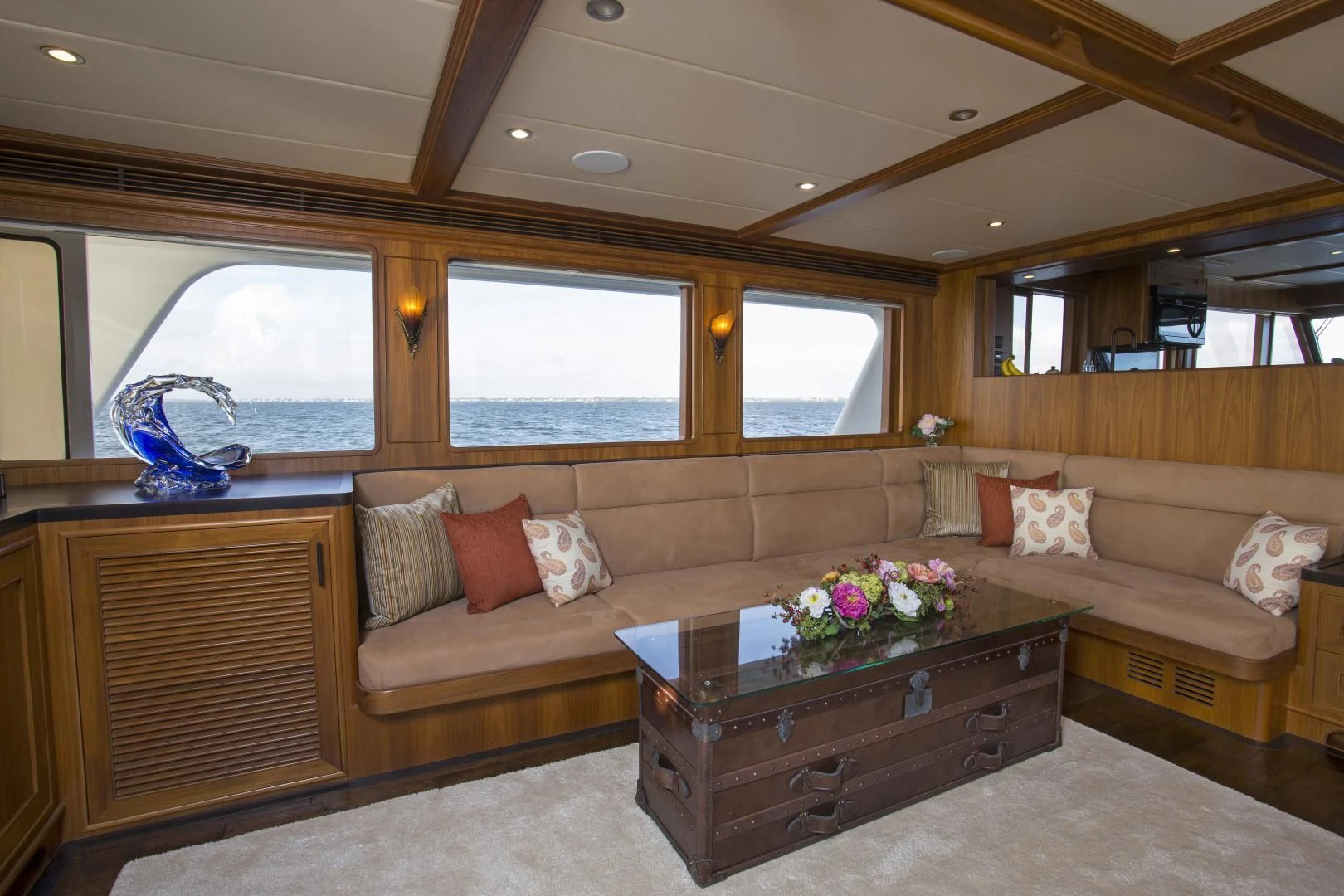 a living room with a couch and a coffee table aboard ON LIBERTY Yacht for Sale