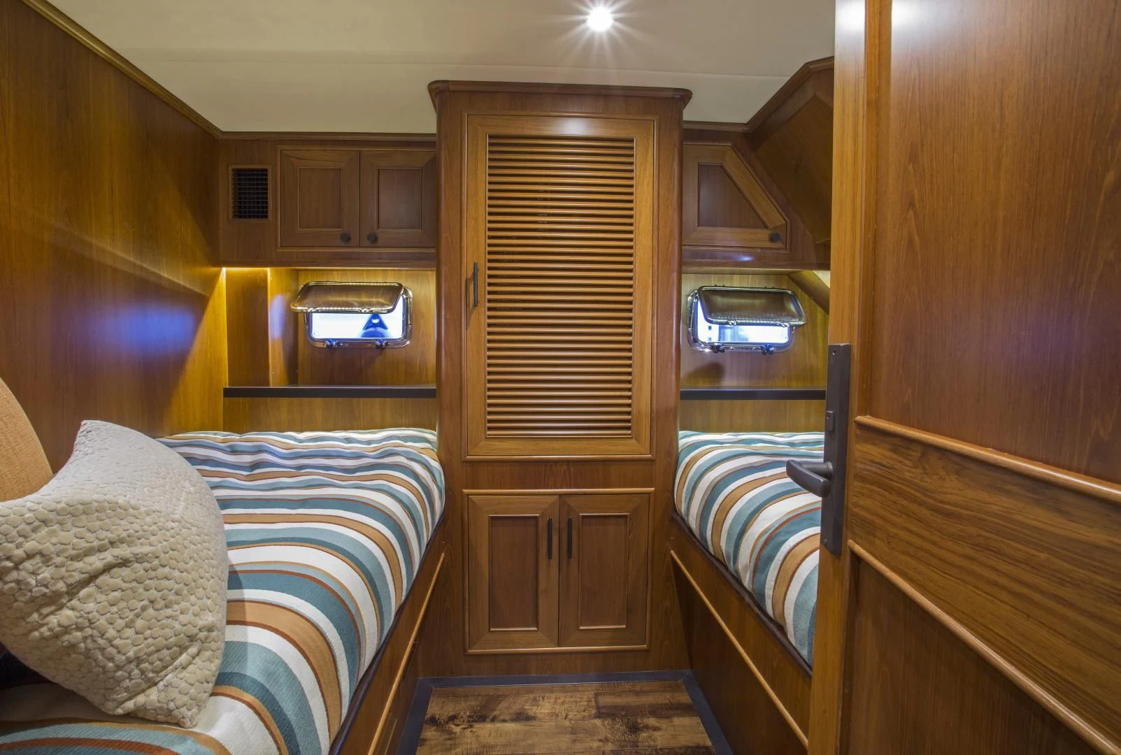a room with a bed and a closet aboard ON LIBERTY Yacht for Sale