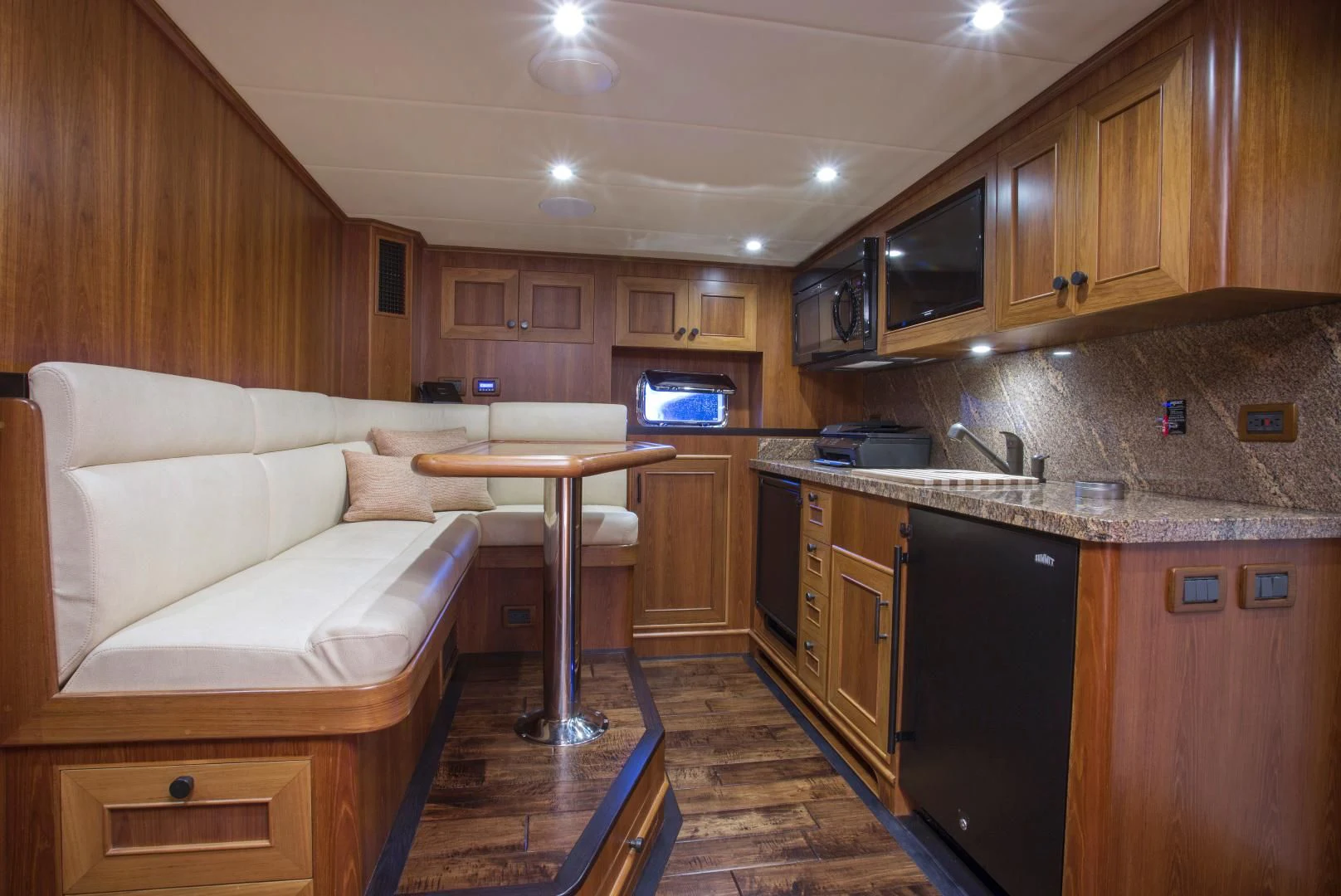 a kitchen with wooden cabinets aboard ON LIBERTY Yacht for Sale