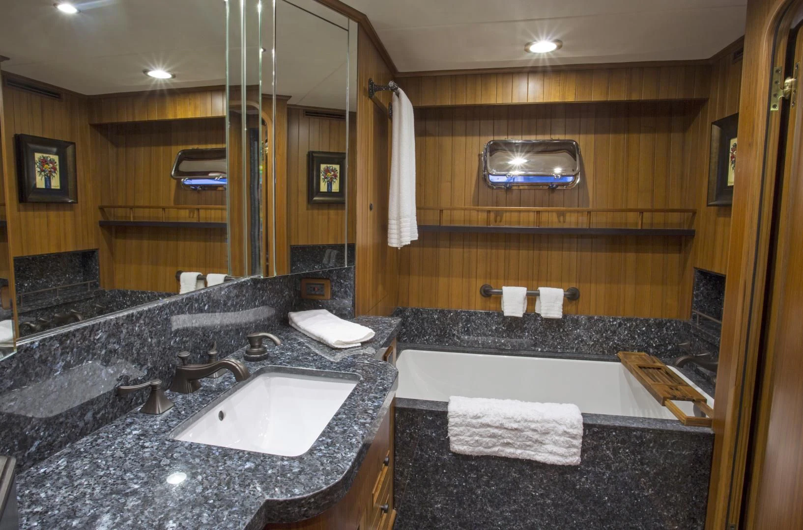 a bathroom with a marble countertop aboard ON LIBERTY Yacht for Sale