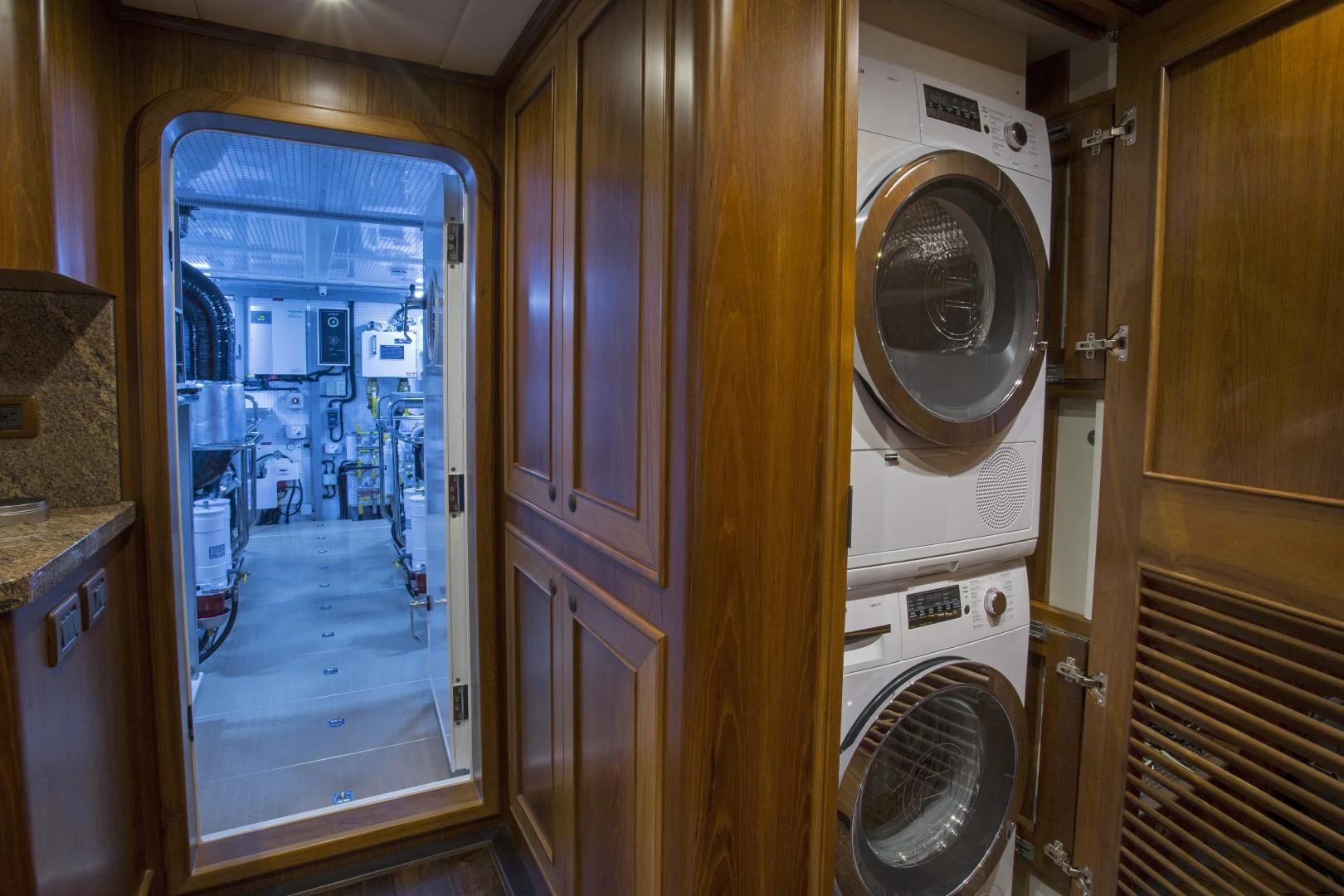 a room with a washing machine and dryer aboard ON LIBERTY Yacht for Sale