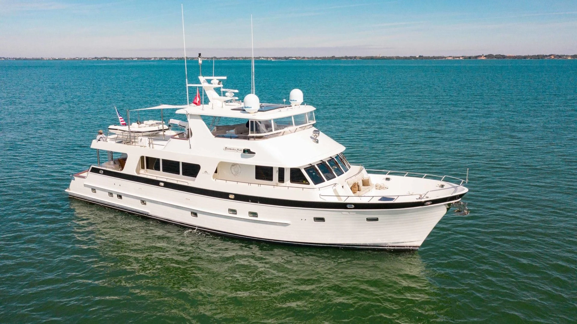 a white boat in the water aboard ON LIBERTY Yacht for Sale