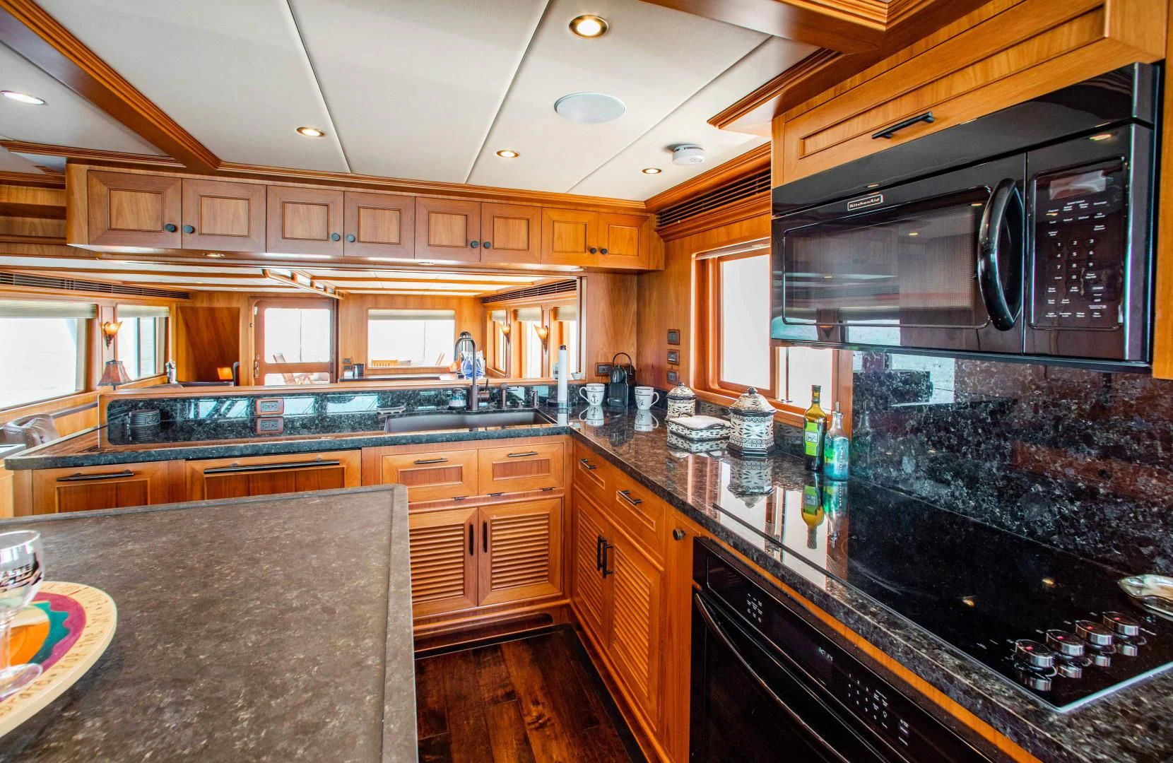 a kitchen with a large island aboard ON LIBERTY Yacht for Sale