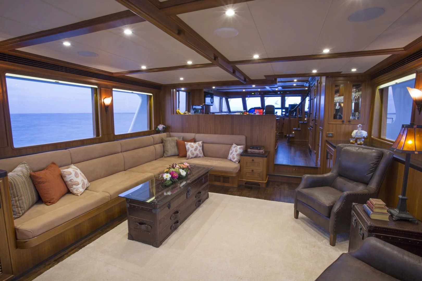 a living room with a couch and a coffee table aboard ON LIBERTY Yacht for Sale