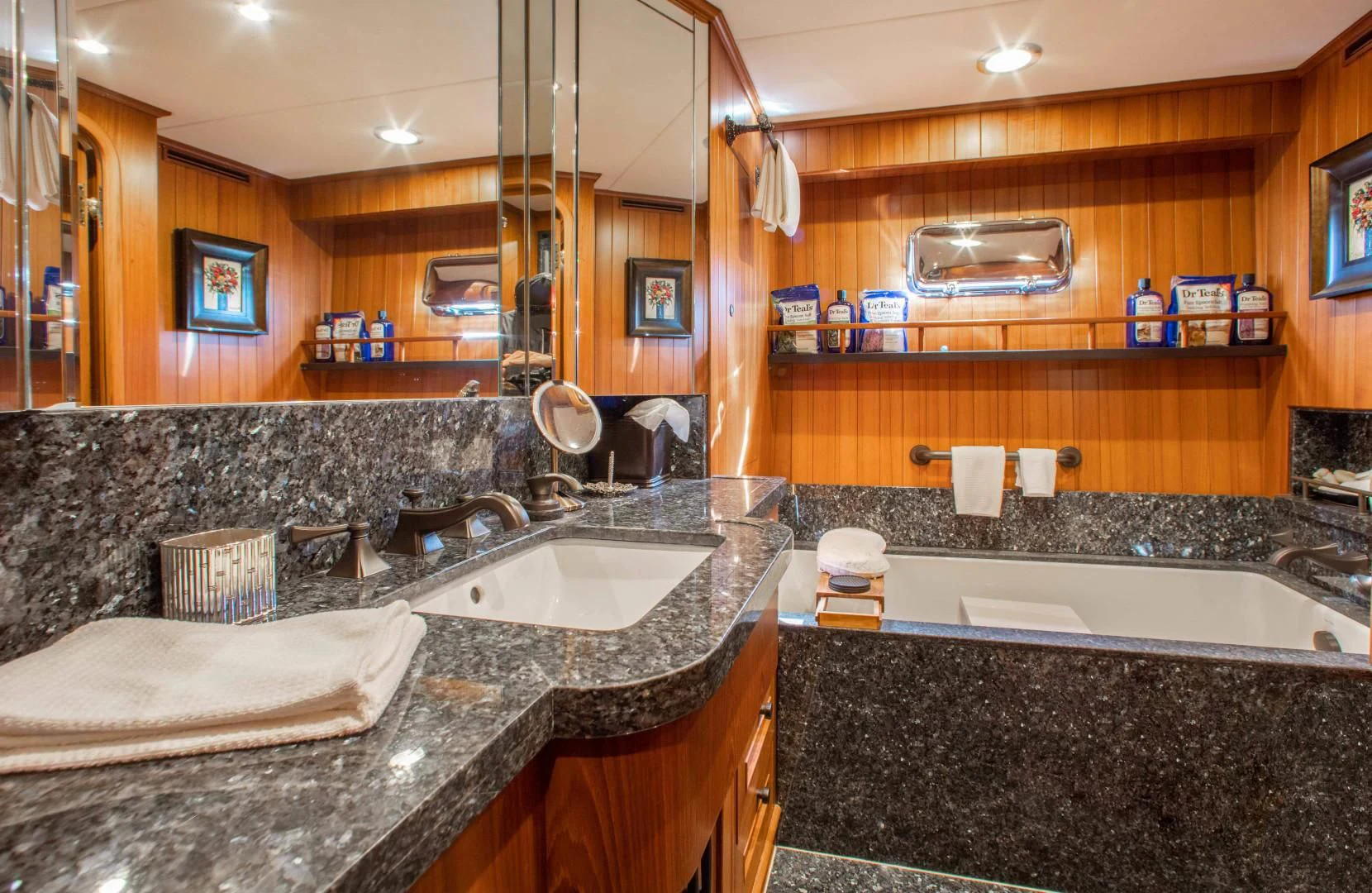 a bathroom with a large marble countertop aboard ON LIBERTY Yacht for Sale