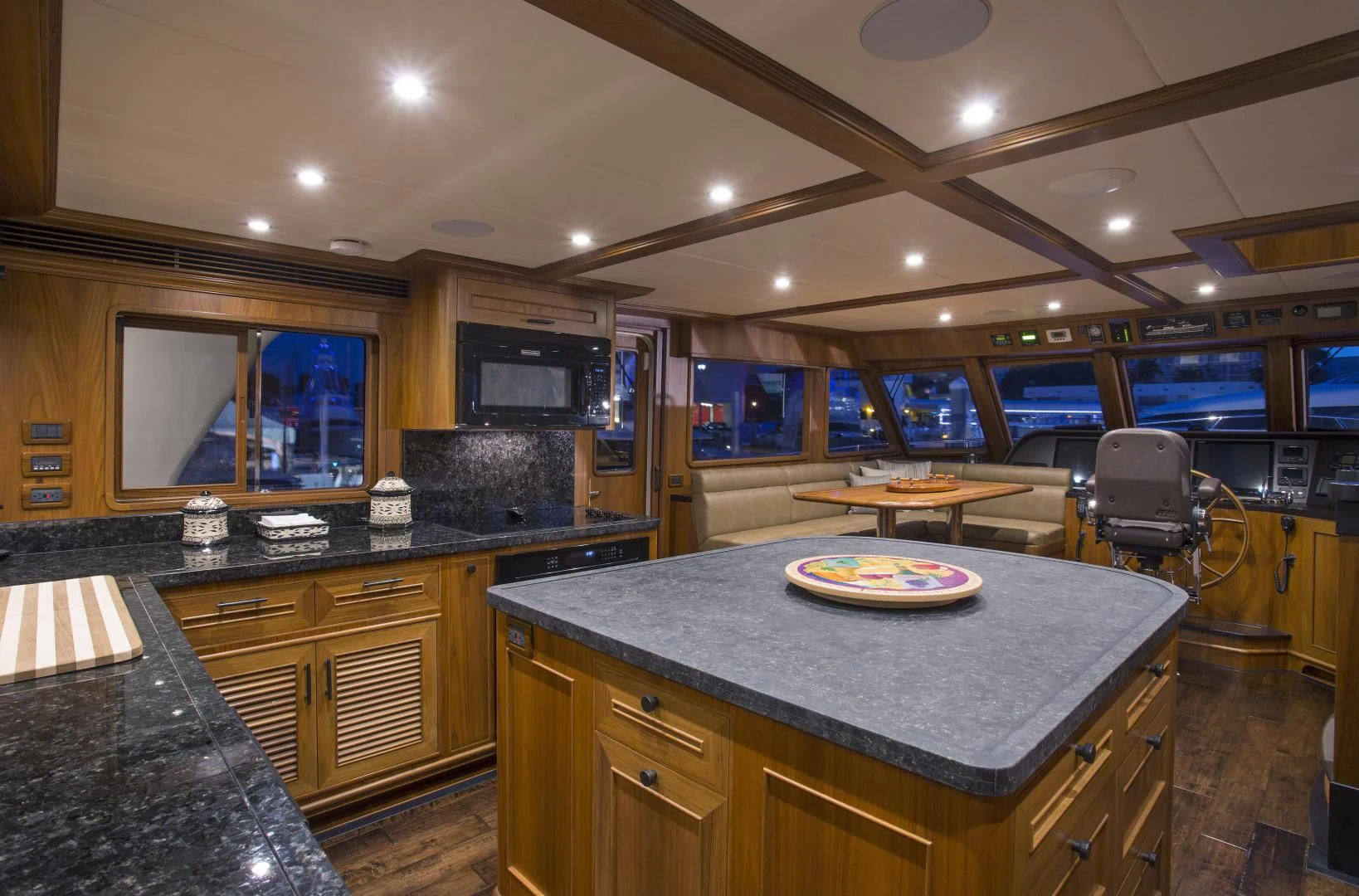 a kitchen with a bar and a table aboard ON LIBERTY Yacht for Sale