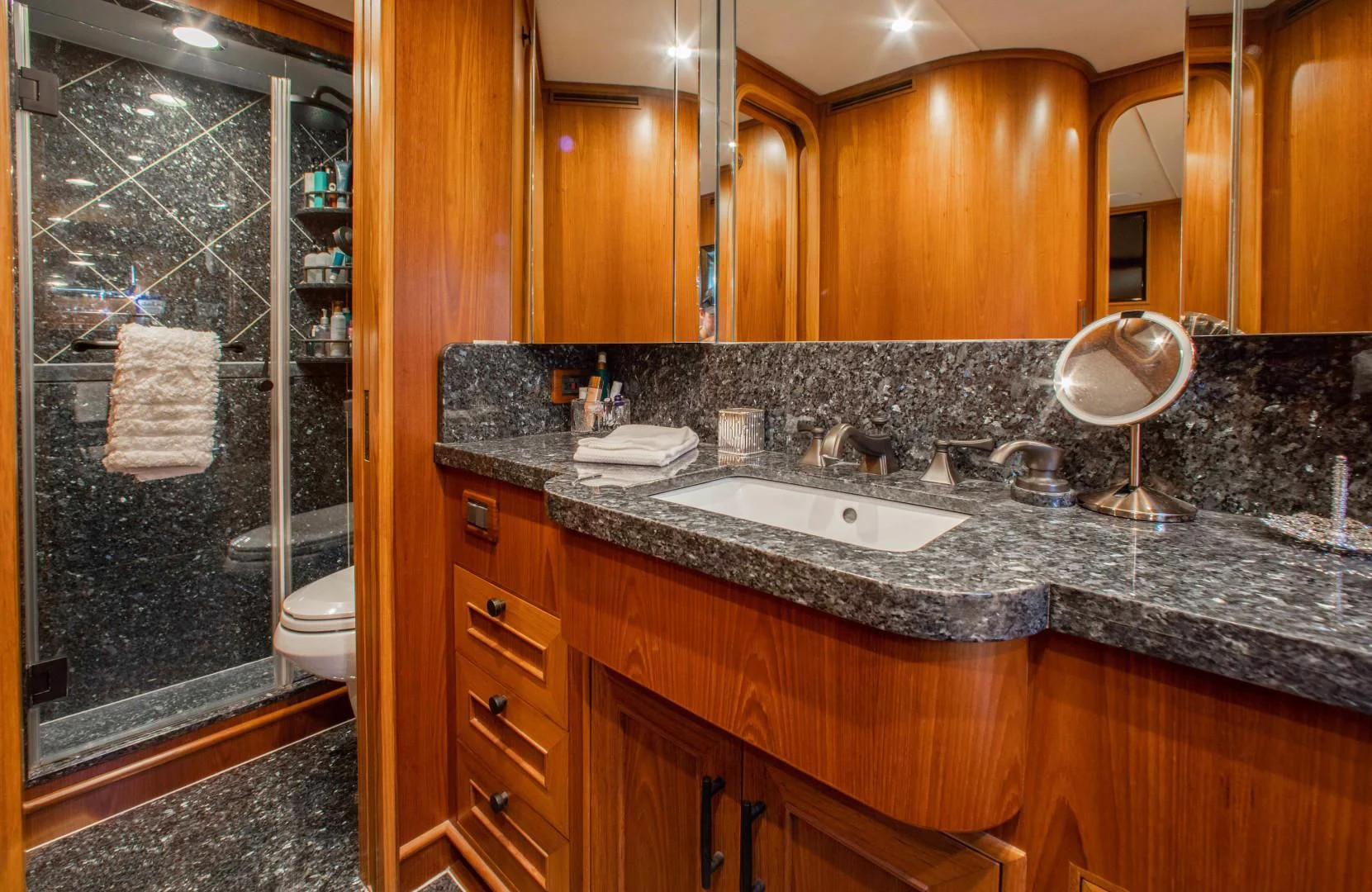 a bathroom with a marble counter top aboard ON LIBERTY Yacht for Sale
