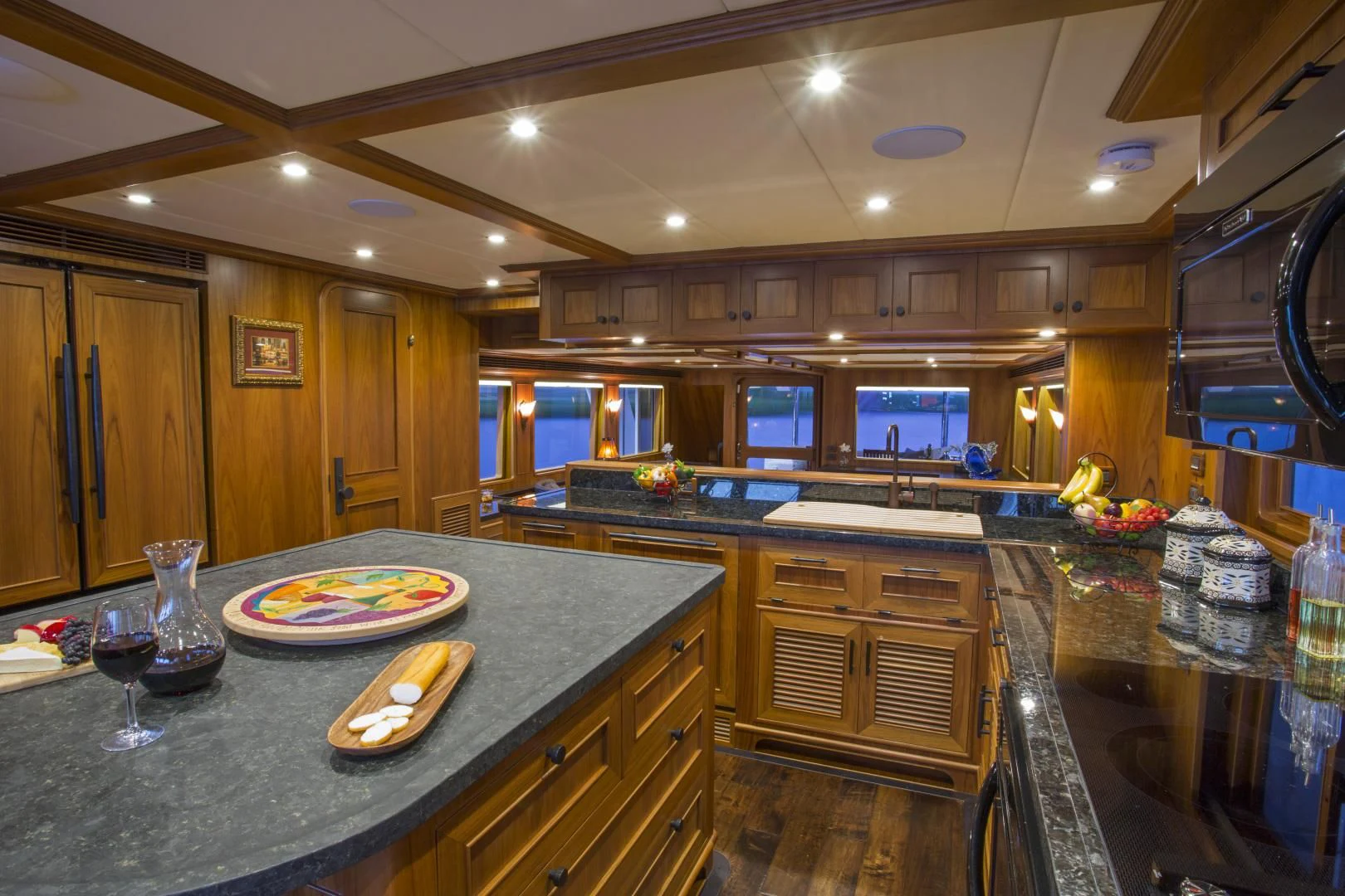 a kitchen with a large island aboard ON LIBERTY Yacht for Sale
