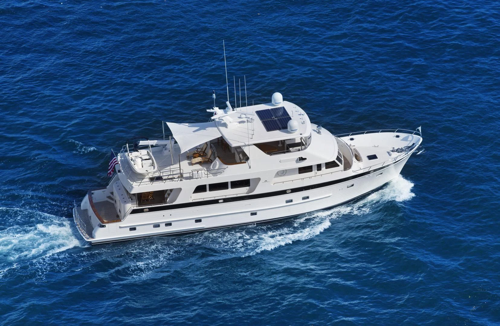a white yacht in the water aboard ON LIBERTY Yacht for Sale