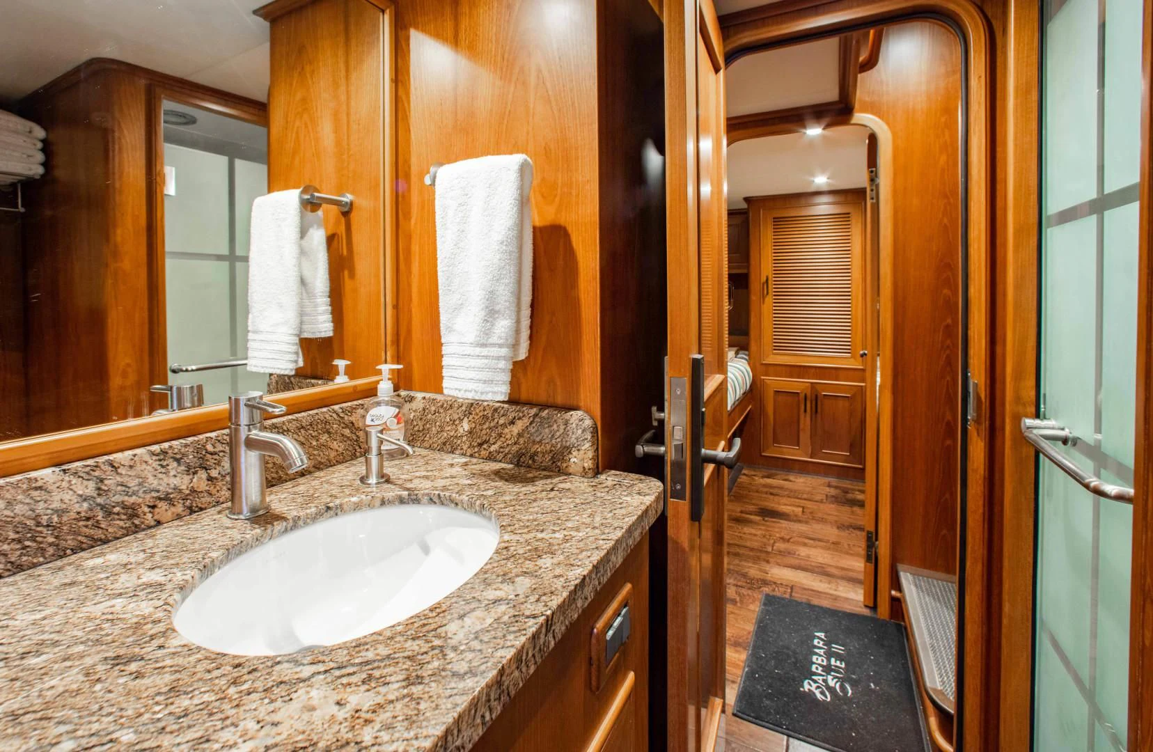 a bathroom with a marble counter top aboard ON LIBERTY Yacht for Sale