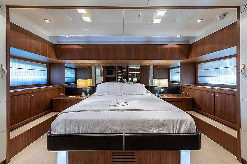 a large bed in a room aboard REFLECT Yacht for Sale
