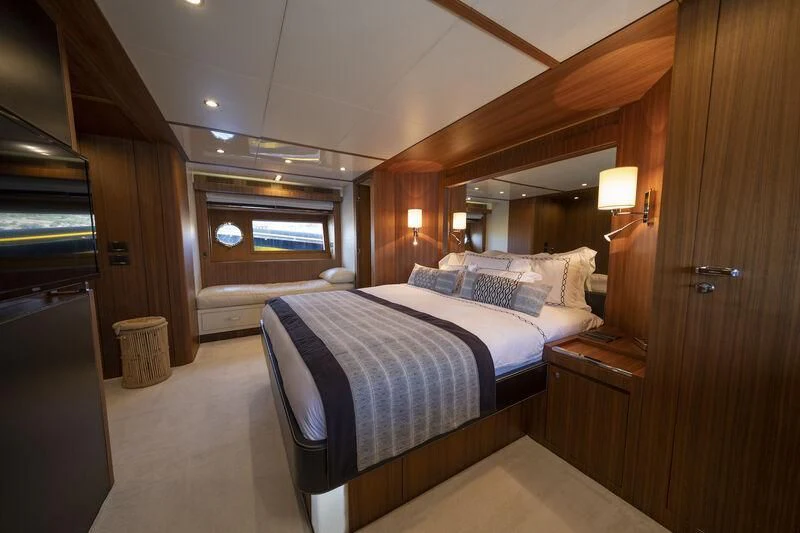 a bed in a room aboard REFLECT Yacht for Sale