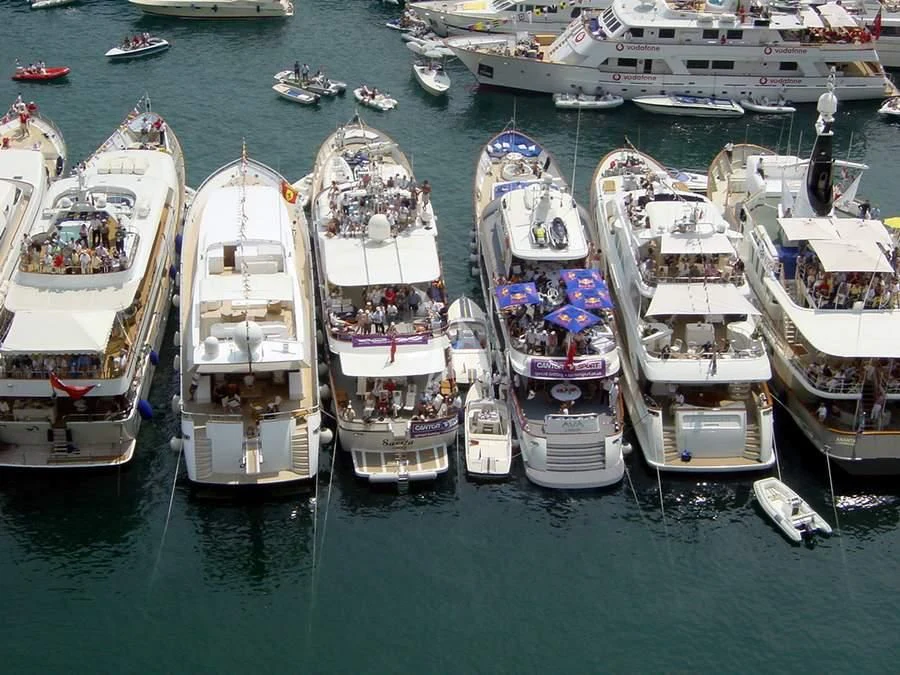a group of boats are parked in the water aboard AVA Yacht for Charter